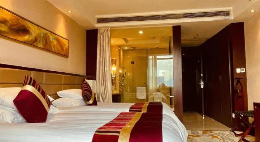 Bed in New Century Grand Hotel Lishui Huaqiao