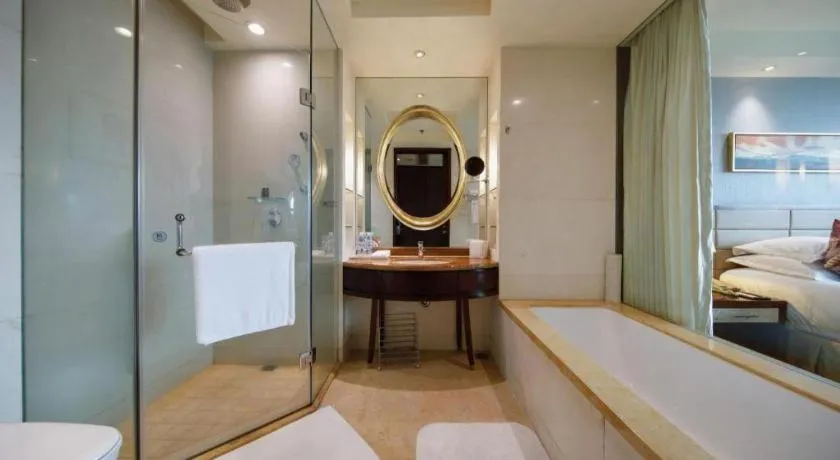 Bed in New Century Grand Hotel Lishui Huaqiao