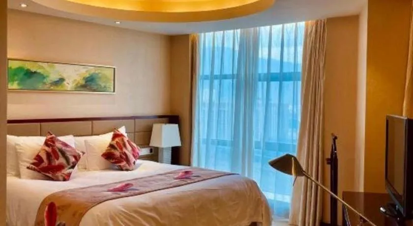 Bed in New Century Grand Hotel Lishui Huaqiao