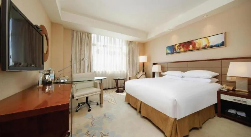 Bed in New Century Grand Hotel Lishui Huaqiao
