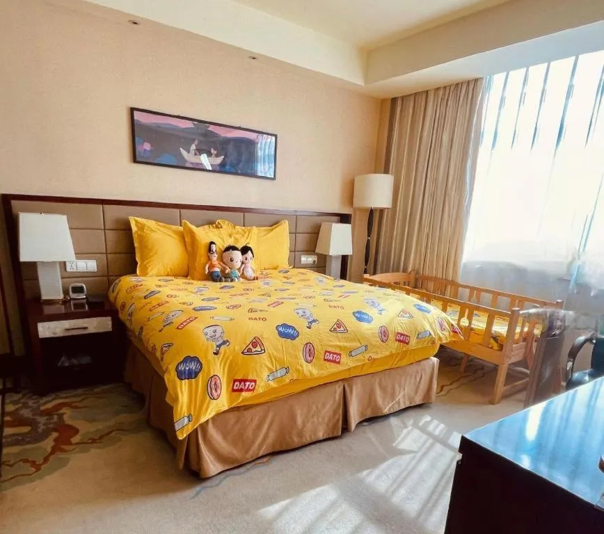 Bed in New Century Grand Hotel Lishui Huaqiao