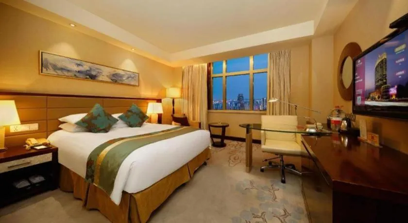 Bed in New Century Grand Hotel Lishui Huaqiao