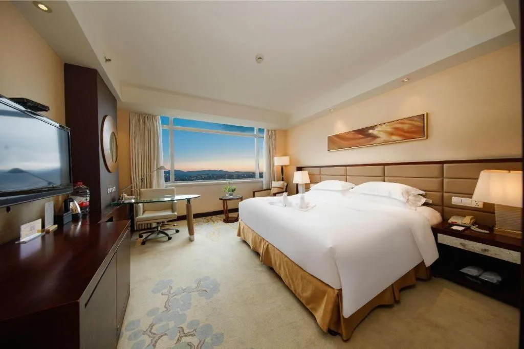 Bed in New Century Grand Hotel Lishui Huaqiao