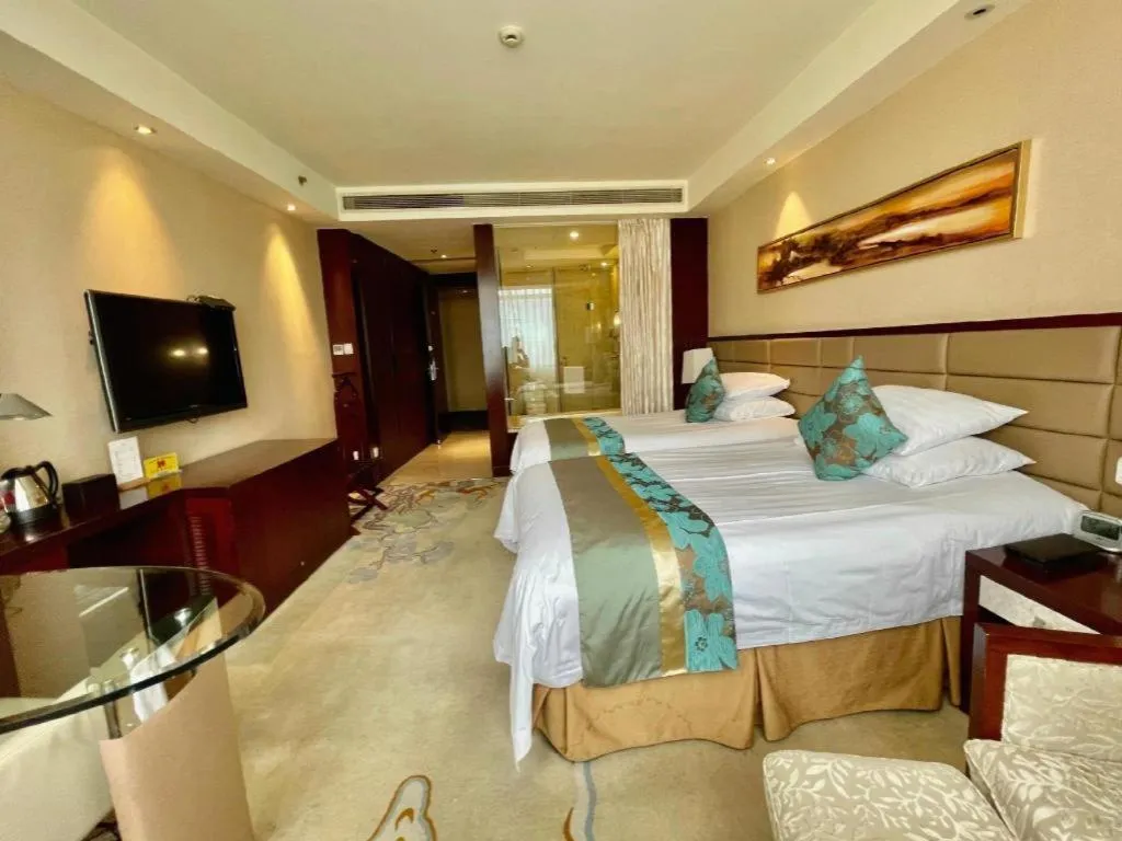 Bed in New Century Grand Hotel Lishui Huaqiao