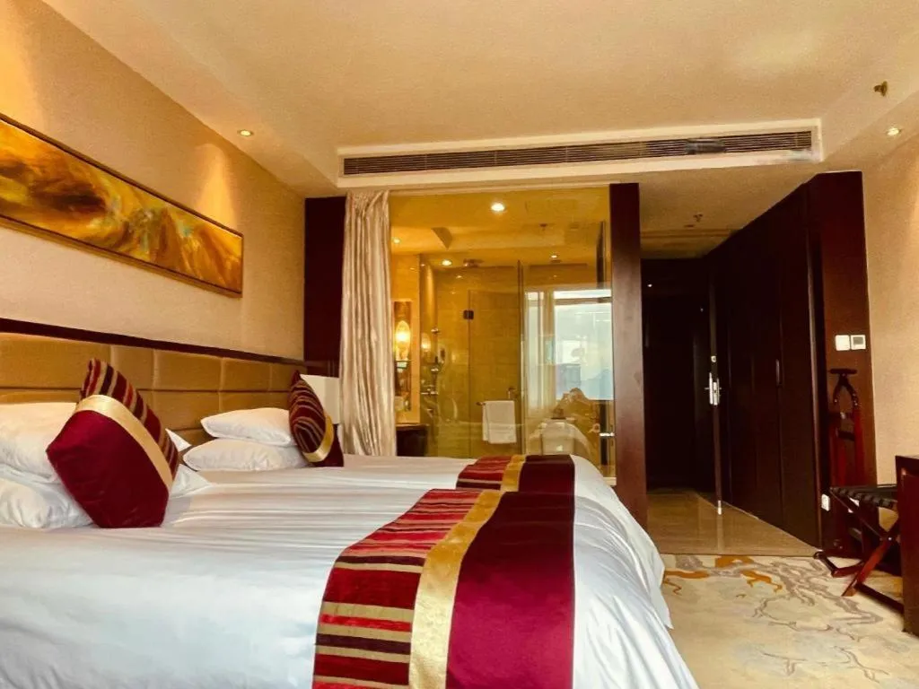Bed in New Century Grand Hotel Lishui Huaqiao