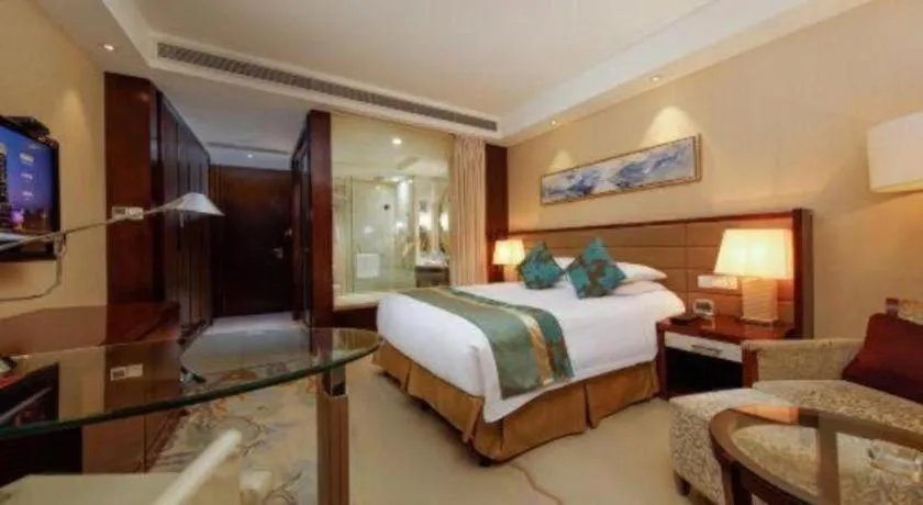 Bed in New Century Grand Hotel Lishui Huaqiao