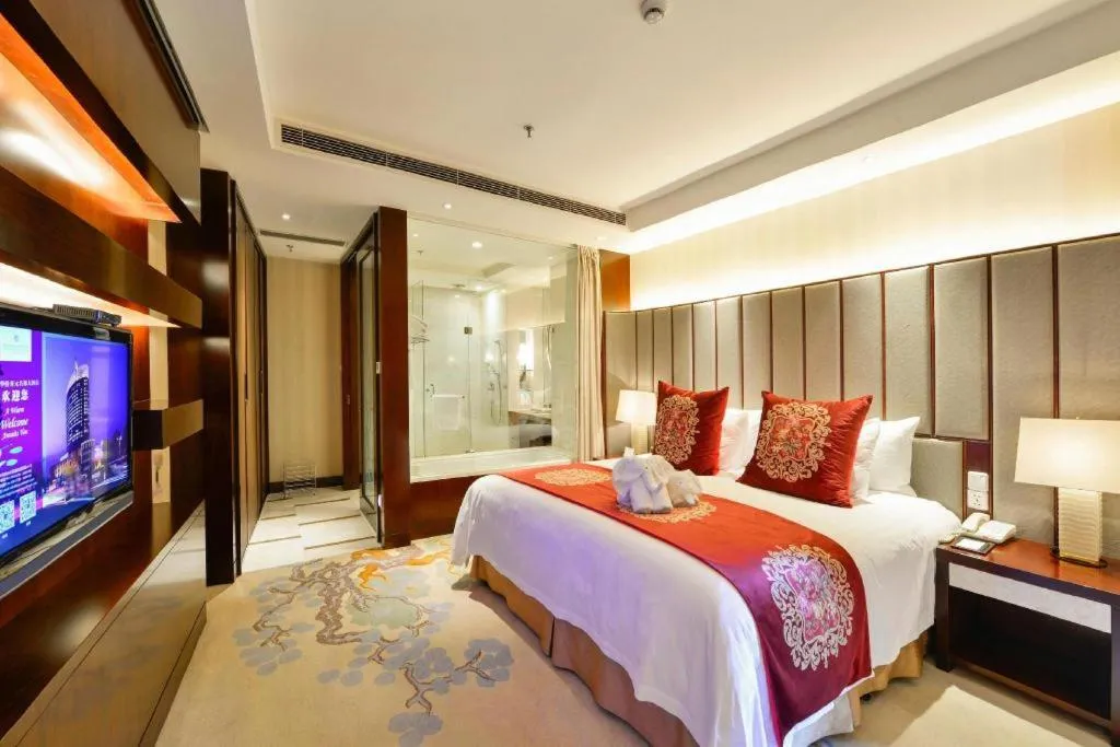 Bed in New Century Grand Hotel Lishui Huaqiao
