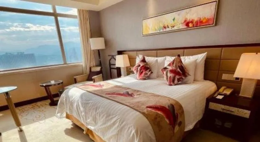 Bed in New Century Grand Hotel Lishui Huaqiao