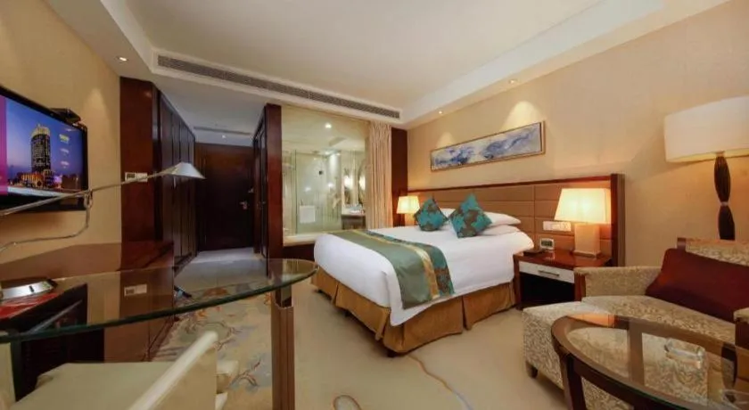 Bed in New Century Grand Hotel Lishui Huaqiao