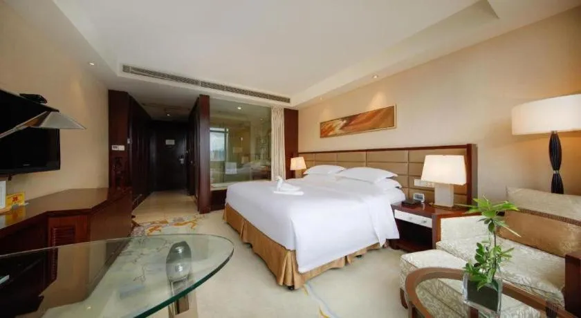 Bed in New Century Grand Hotel Lishui Huaqiao
