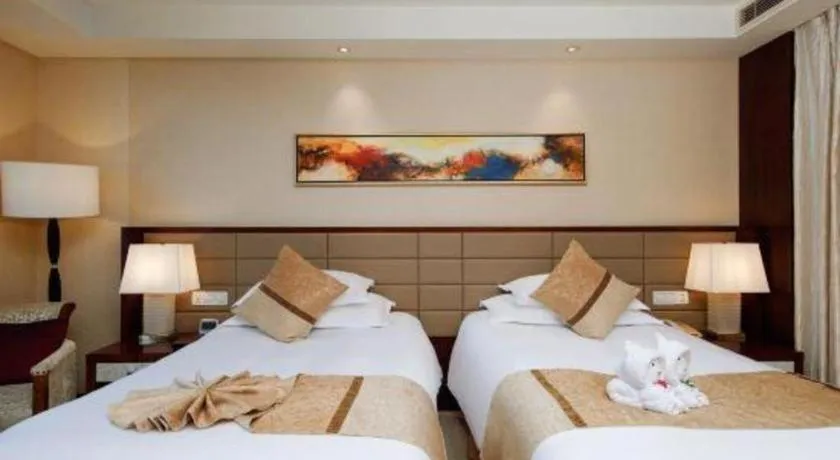 Bed in New Century Grand Hotel Lishui Huaqiao