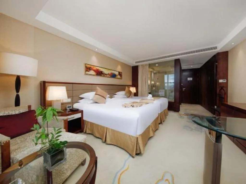 Bed in New Century Grand Hotel Lishui Huaqiao