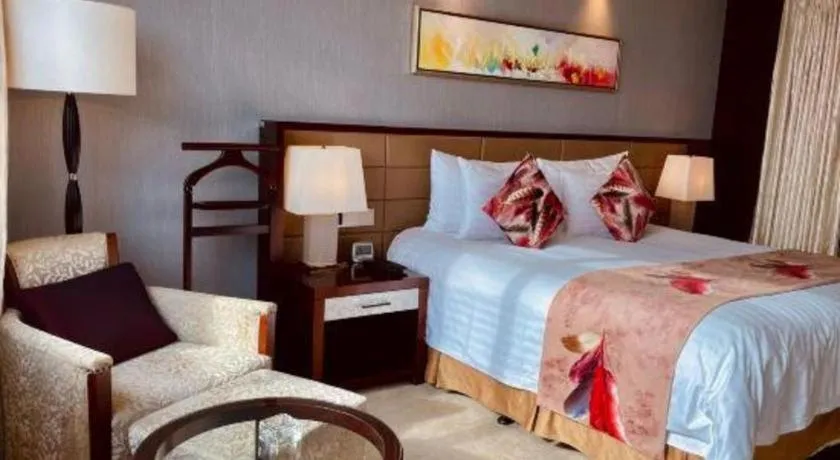 Bed in New Century Grand Hotel Lishui Huaqiao