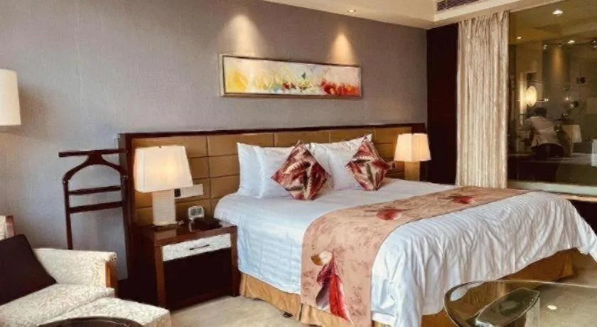 Bed in New Century Grand Hotel Lishui Huaqiao