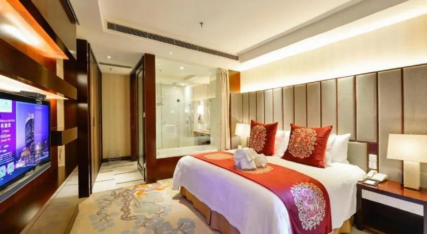 Bed in New Century Grand Hotel Lishui Huaqiao