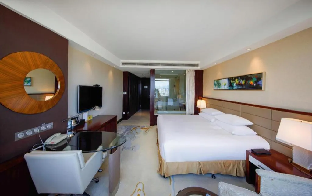 Bed in New Century Grand Hotel Lishui Huaqiao