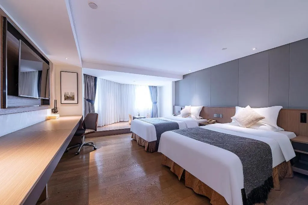 Bed in Zhongshan Louis Hotel