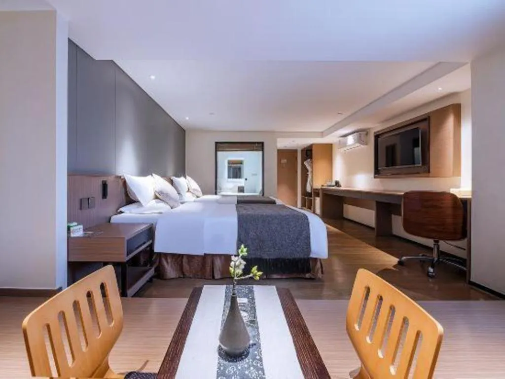 Bed in Zhongshan Louis Hotel