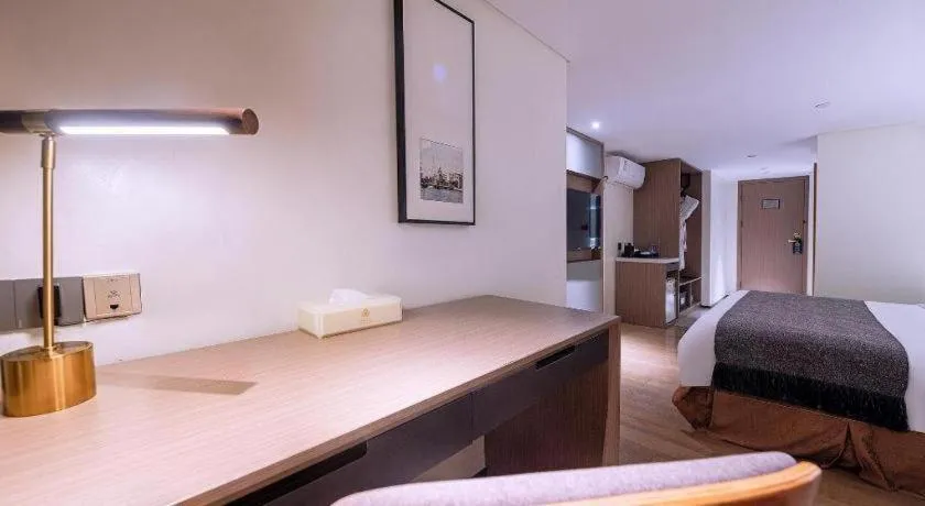 Bed in Zhongshan Louis Hotel