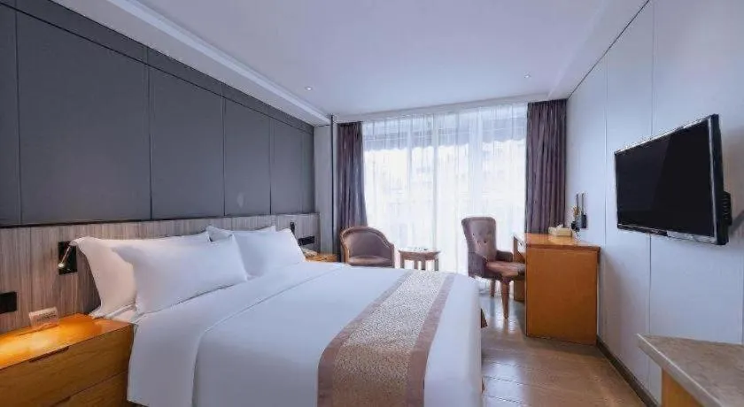 Bed in Zhongshan Louis Hotel