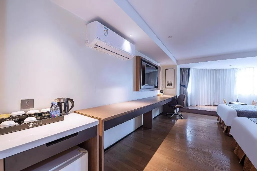 Bed in Zhongshan Louis Hotel