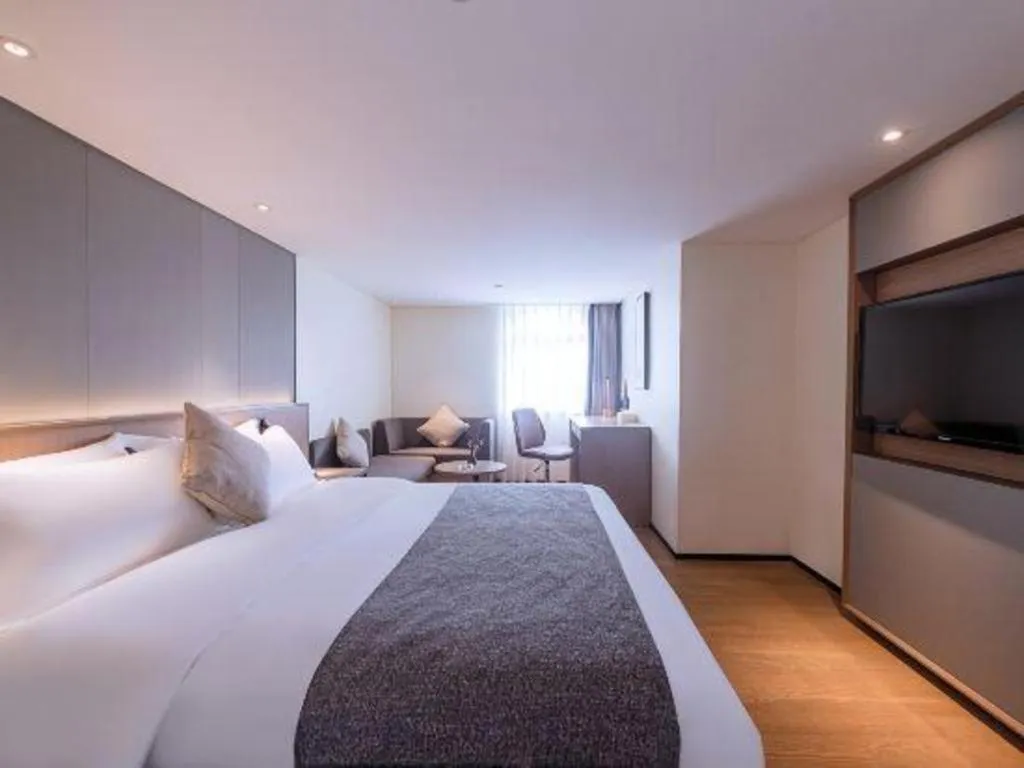 Bed in Zhongshan Louis Hotel