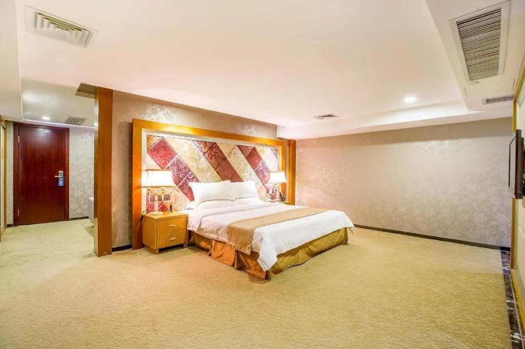 Bed in Zhongshan Louis Hotel