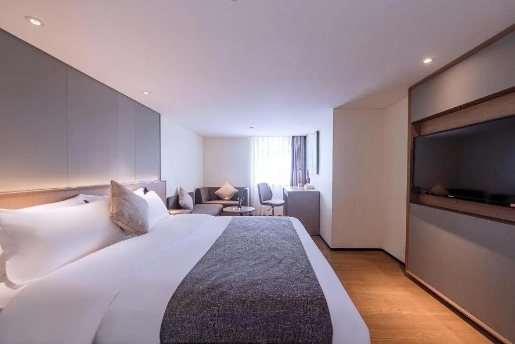 Bed in Zhongshan Louis Hotel