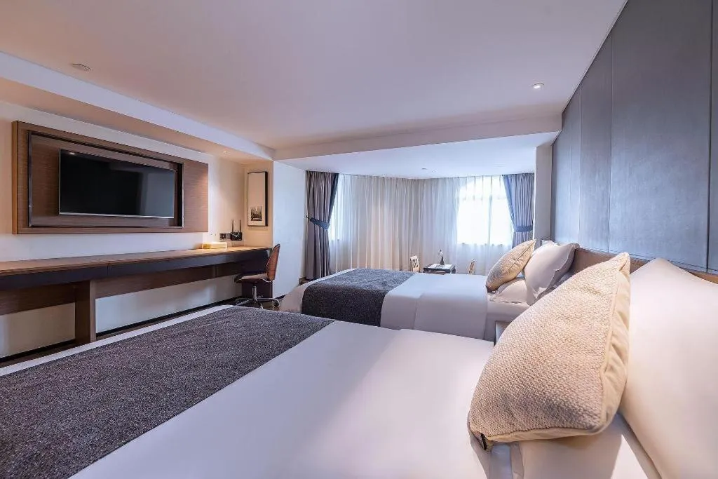 Bed in Zhongshan Louis Hotel