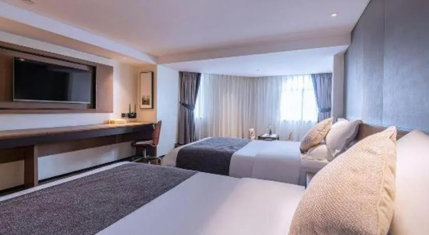 Bed in Zhongshan Louis Hotel