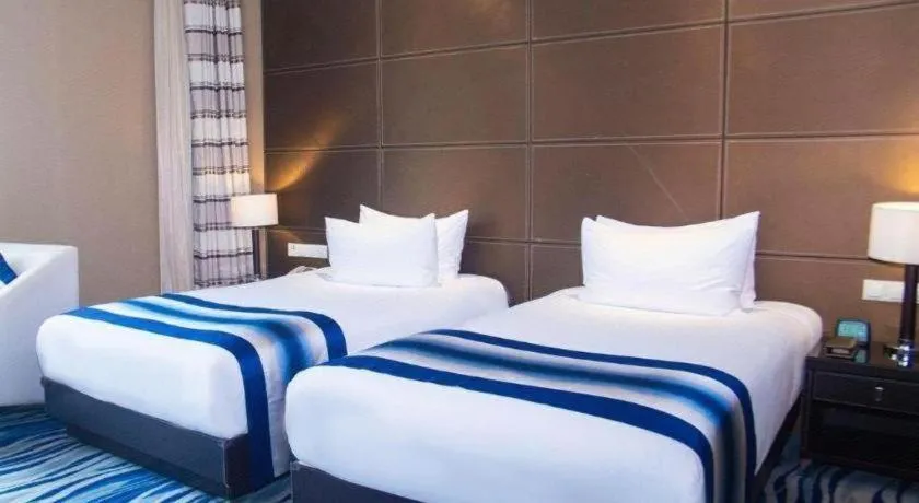 Bed in Brigh Radiance Hotel Yantai