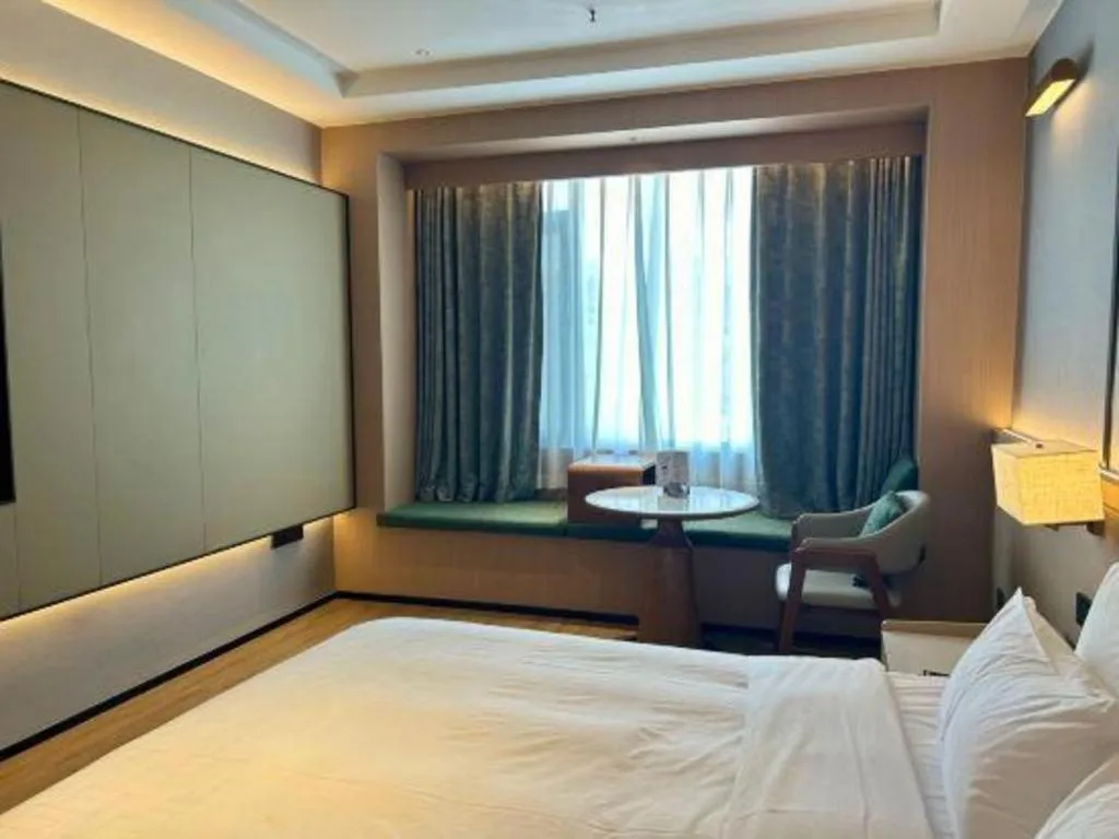 Bed in Zhangjiagang Jiangnan Garden Hotel