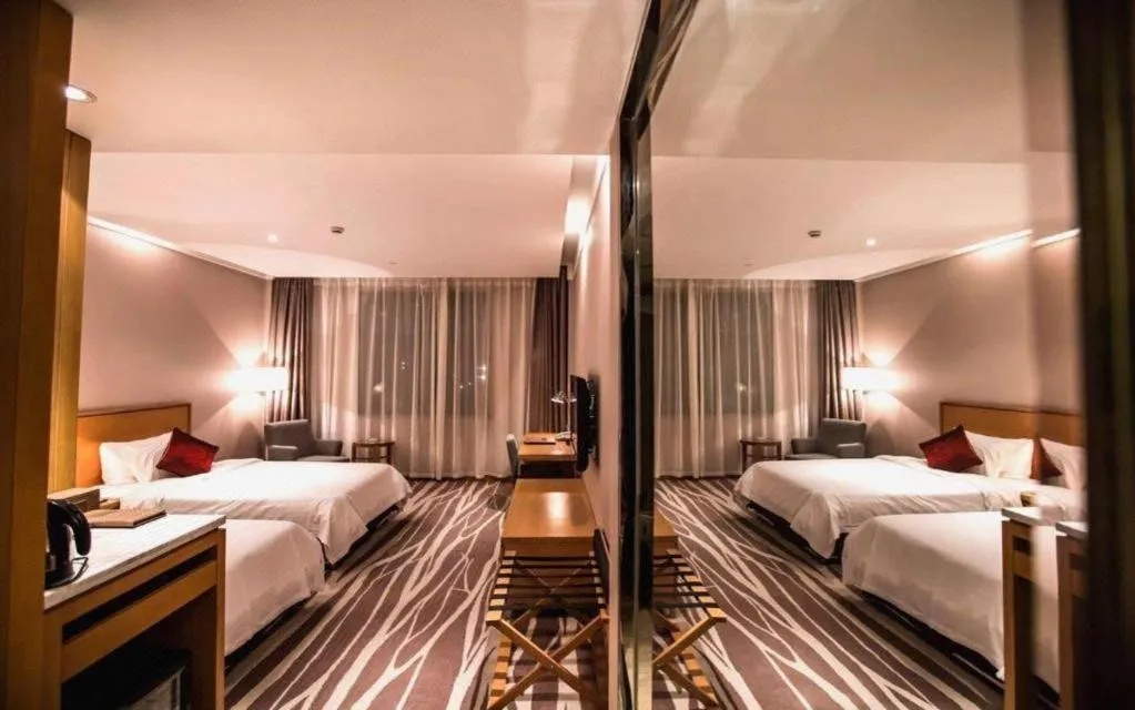 Bed in Zhangjiagang Jiangnan Garden Hotel