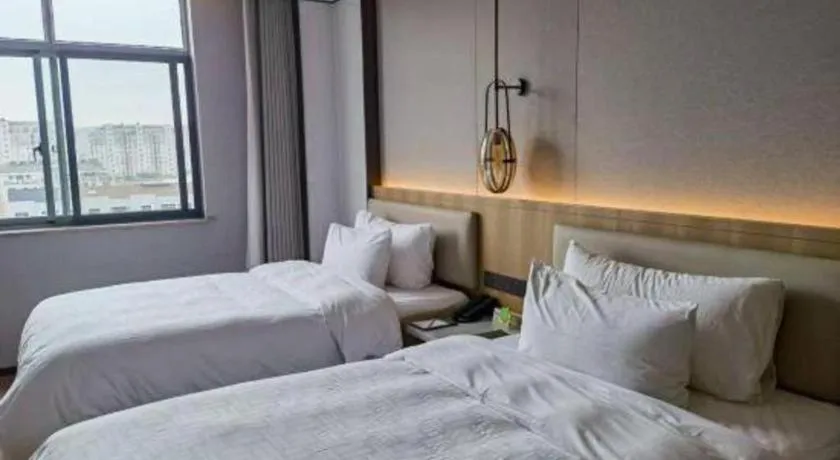 Bed in Zhangjiagang Jiangnan Garden Hotel