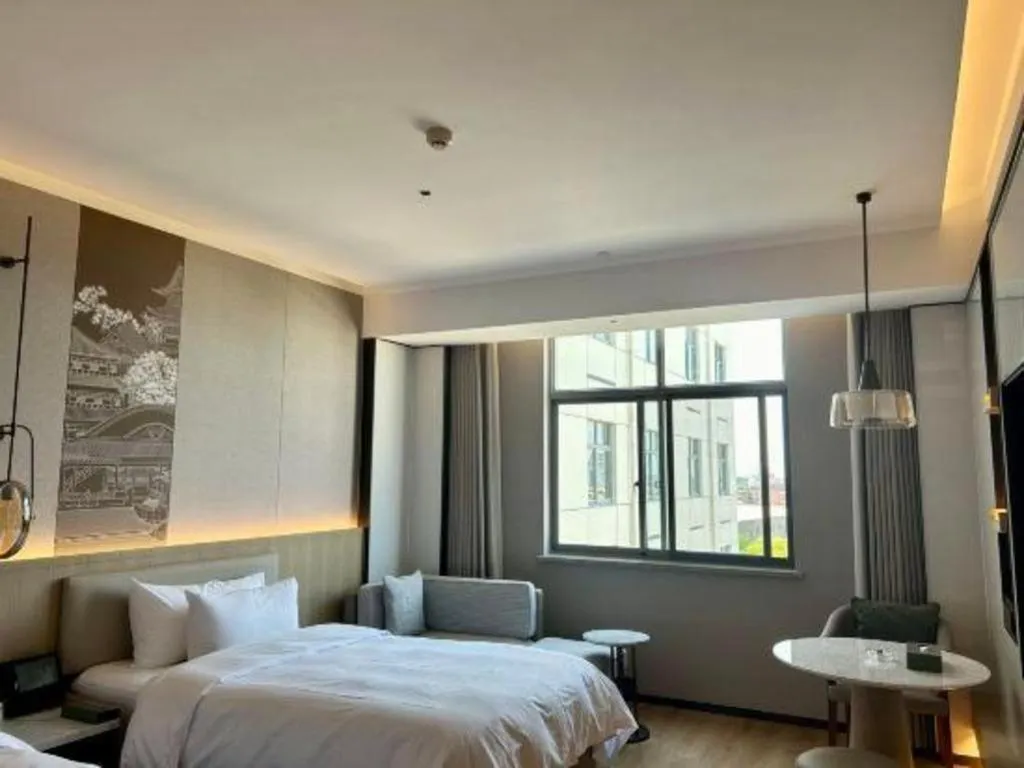 Bed in Zhangjiagang Jiangnan Garden Hotel