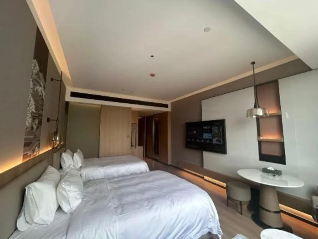 Bed in Zhangjiagang Jiangnan Garden Hotel