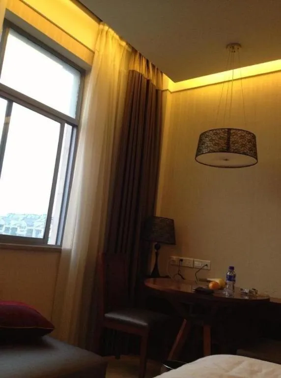 Bed in Zhangjiagang Jiangnan Garden Hotel