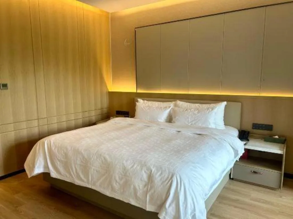 Bed in Zhangjiagang Jiangnan Garden Hotel