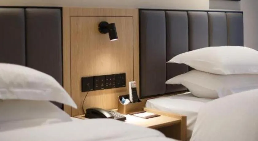 Bed in GreenTree Inn Jiangsu Changzhou Henglin Town Shuntong Road Express Hotel