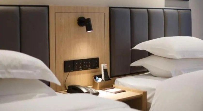 Bed in GreenTree Inn Jiangsu Changzhou Henglin Town Shuntong Road Express Hotel