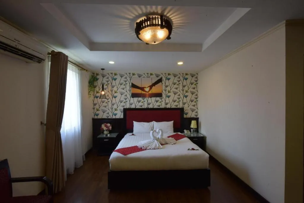 Bed in Helios Legend Hotel