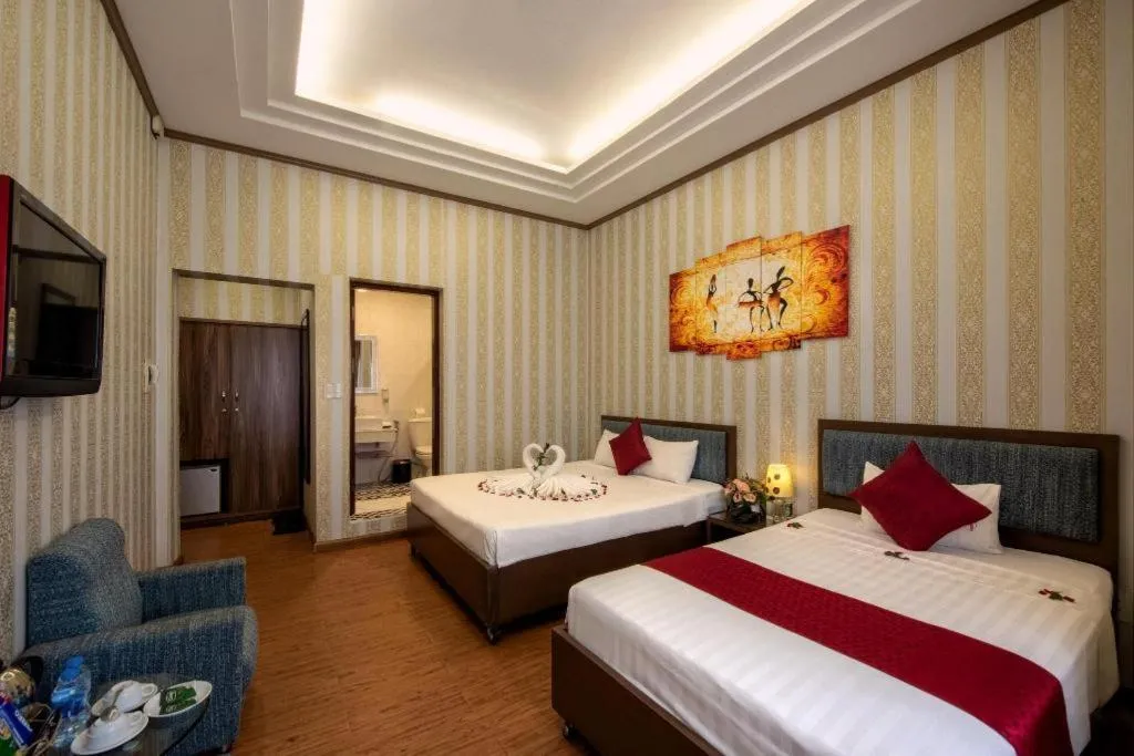 Bed in Helios Legend Hotel