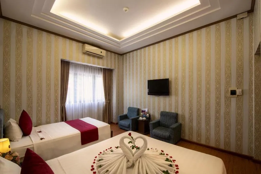 Bed in Helios Legend Hotel