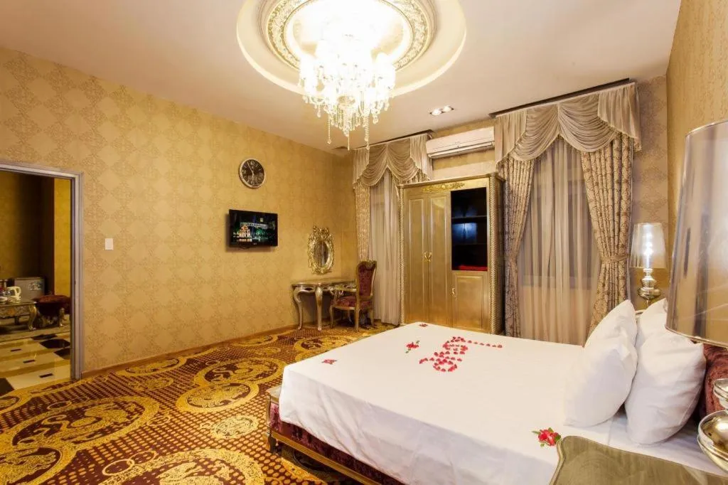 Bed in Helios Legend Hotel