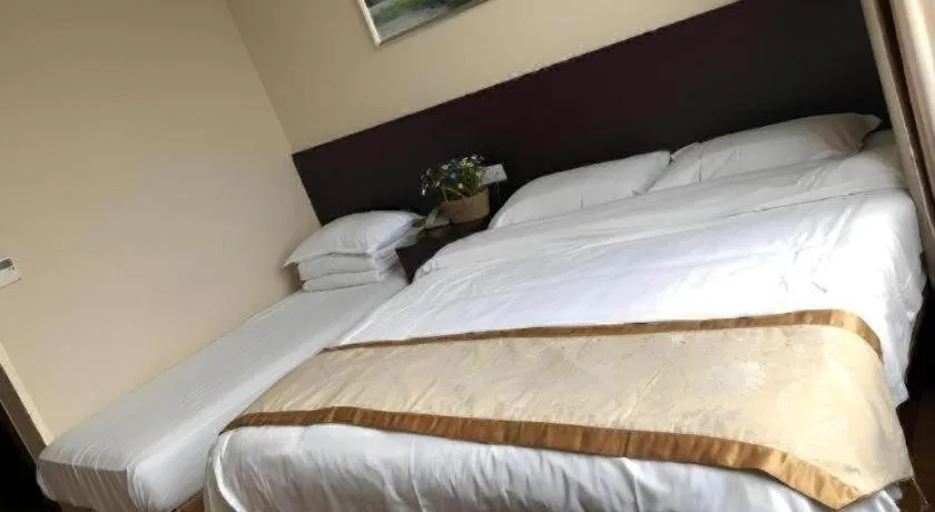 Bed in GreenTree Inn Jiangsu Wuxi New District High Speed Rail Station Newland Family Express Hotel