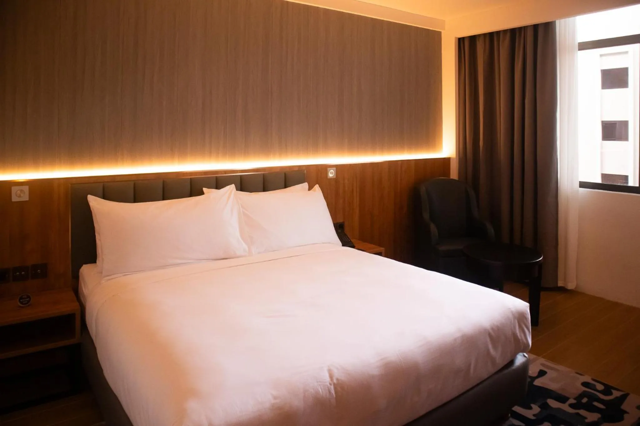 Bedroom, Bed in Aglow Hotel Harbor Bay Batam