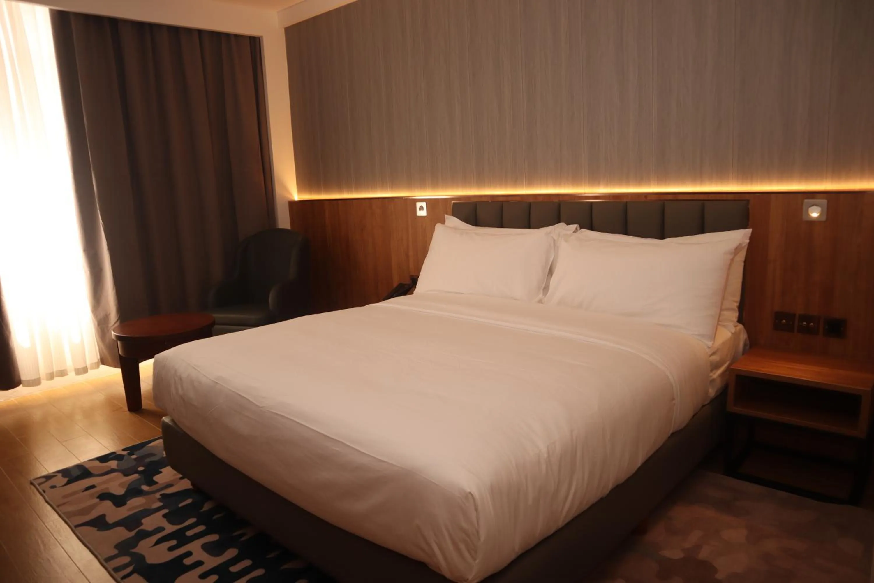 Bed in Aglow Hotel Harbor Bay Batam