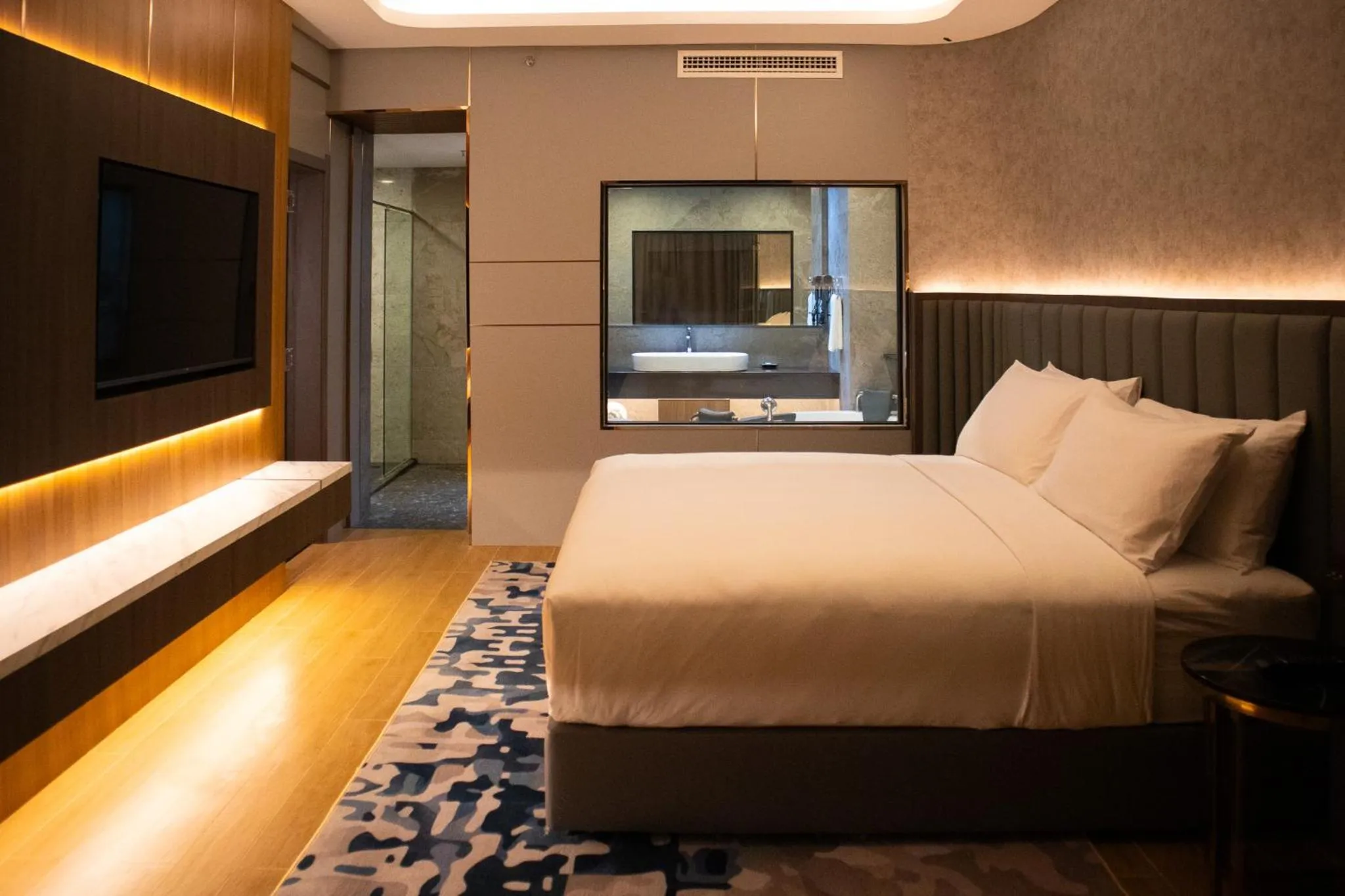 Bed in Aglow Hotel Harbor Bay Batam