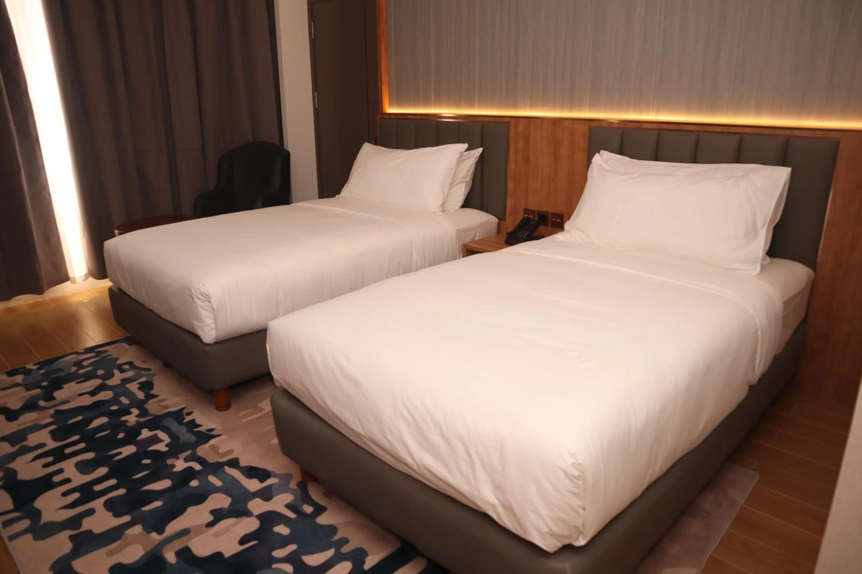 Bed in Aglow Hotel Harbor Bay Batam