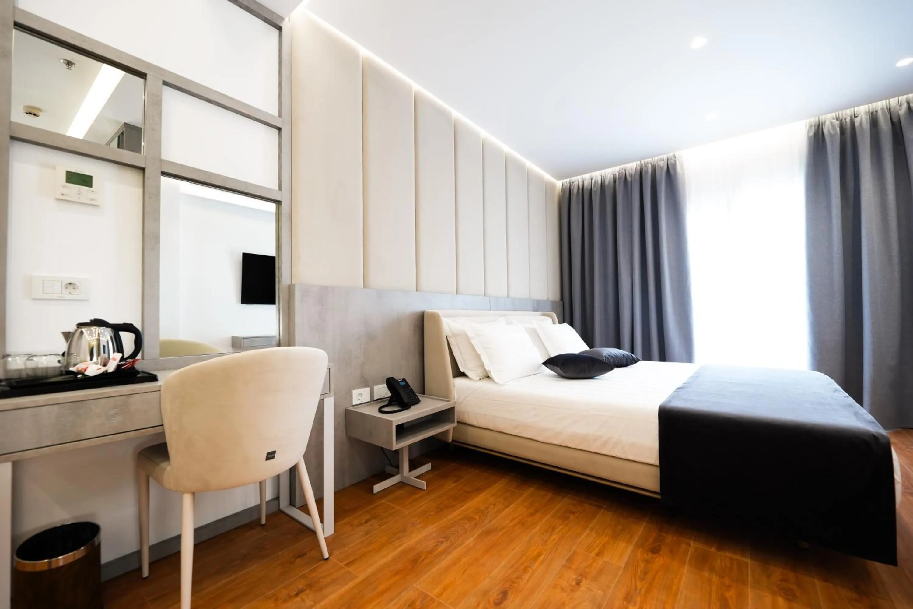 Bed in Naos Luxury Hotel